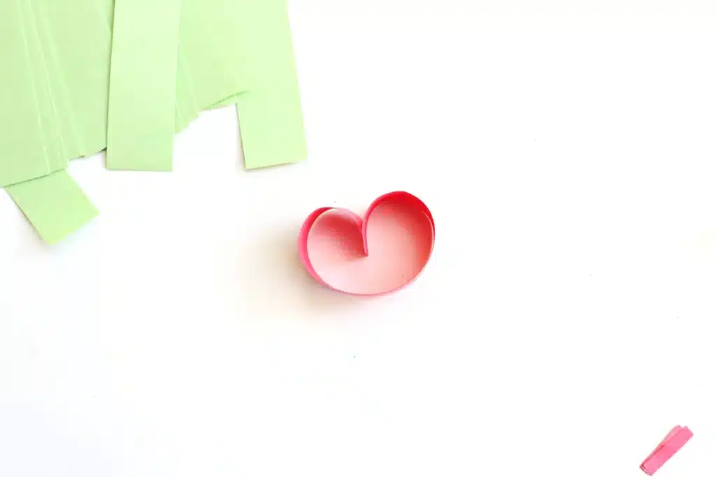 Grinch Paper Chain Countdown - Cultivating Brilliant Minds a red strip of construction paper glued to look like a heart