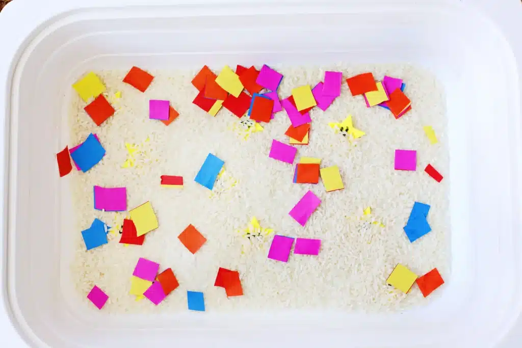 New Year's Countdown Star Hunt Bin - Cultivating Brilliant Minds New Year's Countdown Star Hunt Bin: a rice sensory bin filled with countdown stars to countdown the new year