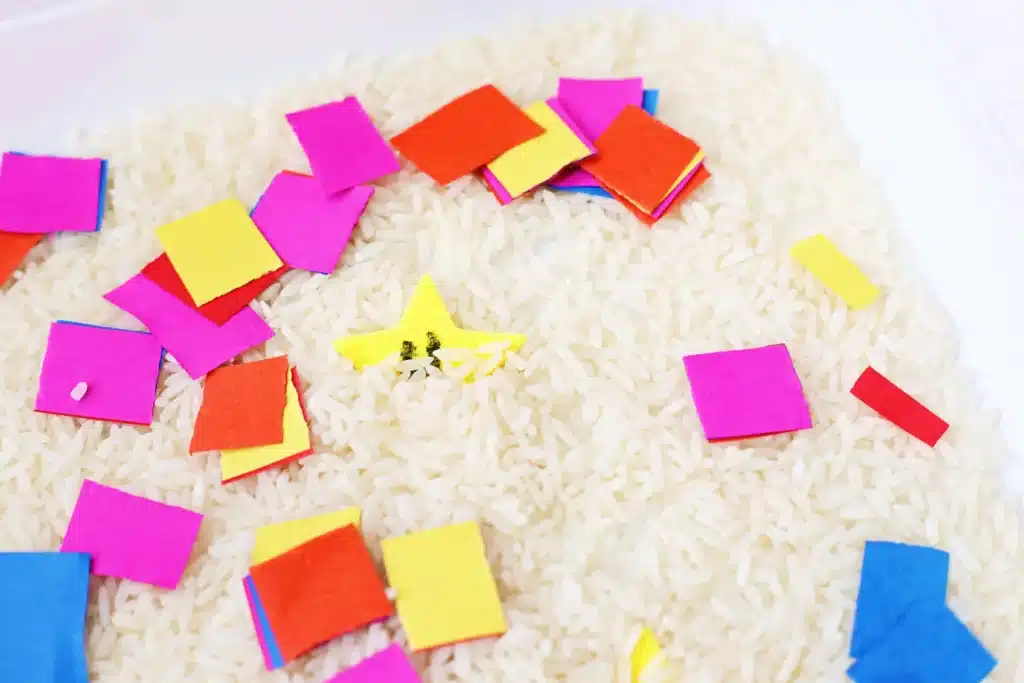 New Year's Countdown Star Hunt Bin - Cultivating Brilliant Minds New Year's Countdown Star Hunt Bin: a rice sensory bin filled with countdown stars to countdown the new year