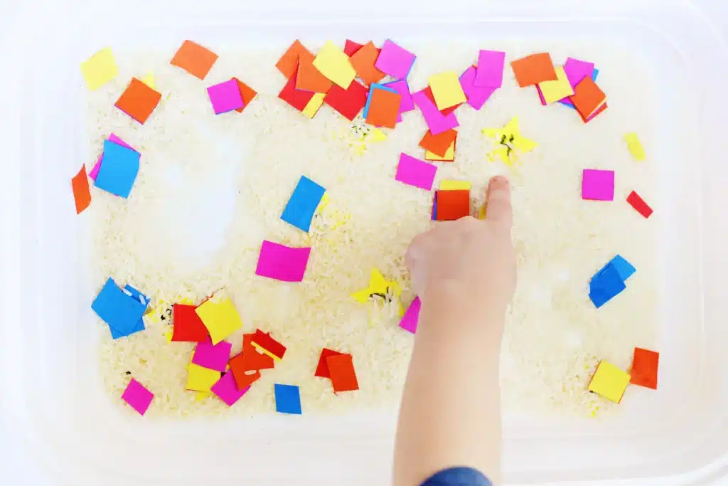 New Year's Countdown Star Hunt Bin - Cultivating Brilliant Minds New Year's Countdown Star Hunt Bin: a rice sensory bin filled with countdown stars to countdown the new year