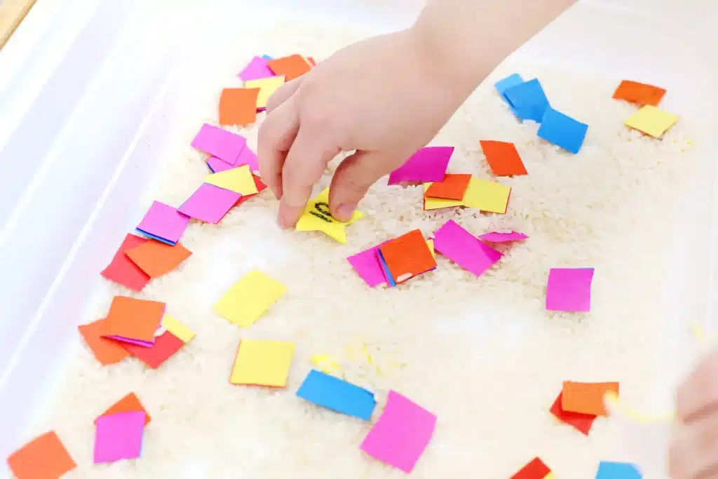 New Year's Countdown Star Hunt Bin - Cultivating Brilliant Minds New Year's Countdown Star Hunt Bin: a rice sensory bin filled with countdown stars to countdown the new year