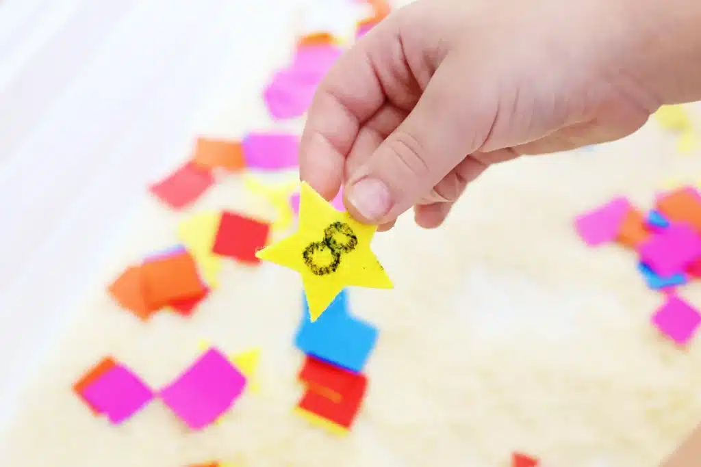 New Year's Countdown Star Hunt Bin - Cultivating Brilliant Minds New Year’s Countdown Star Hunt Sensory Bin a rice sensory bin filled with countdown stars to countdown the new year