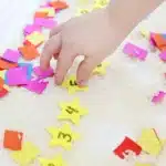 New Year's Countdown Star Hunt Bin - Cultivating Brilliant Minds New Year's Countdown Star Hunt Bin: a rice sensory bin filled with countdown stars to countdown the new year