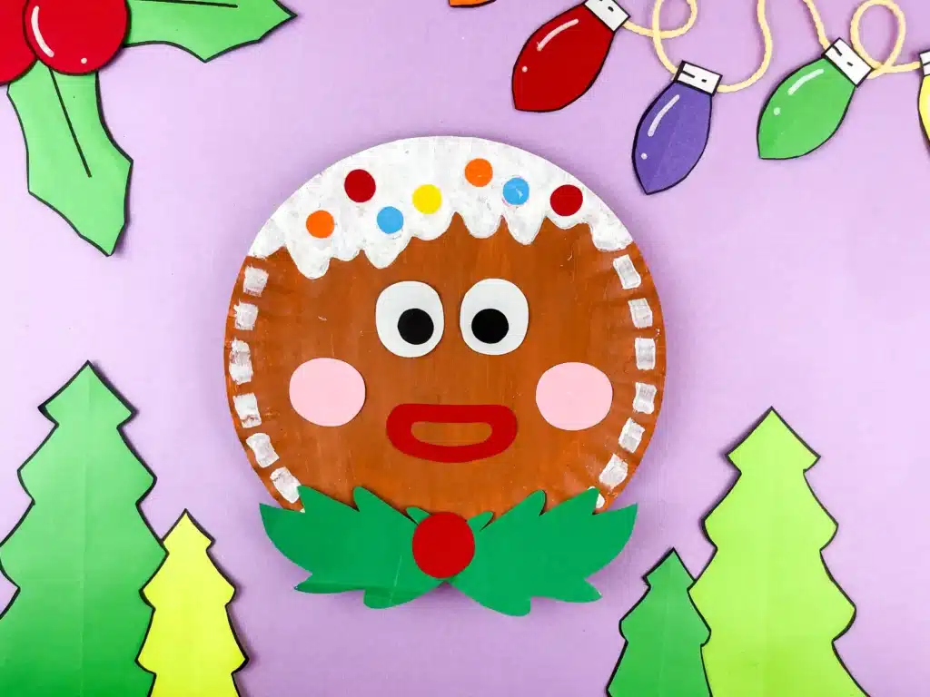 Gingerbread Paper Plate Craft - Cultivating Brilliant Minds a paper plate decorated to look like a gingerbread