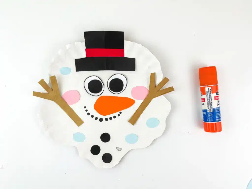 Melted Snowman Paper Plate Craft - Cultivating Brilliant Minds a paper plate craft decorated to look like a melted snowman