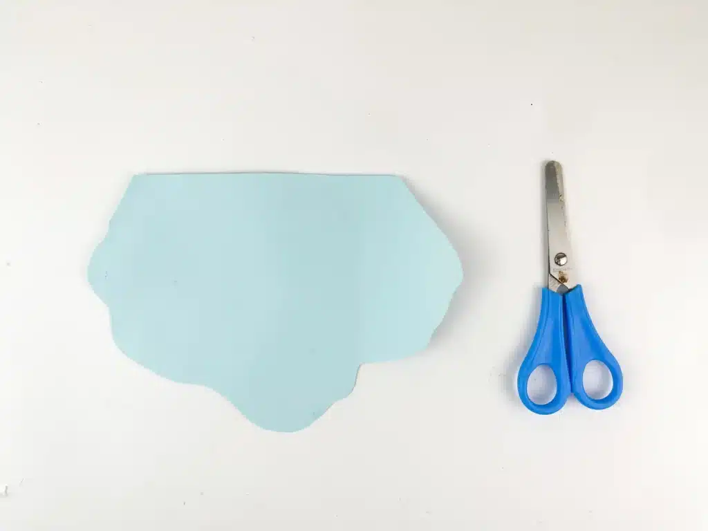 Melted Snowman Paper Plate Craft - Cultivating Brilliant Minds blue construction paper cut to look like ice