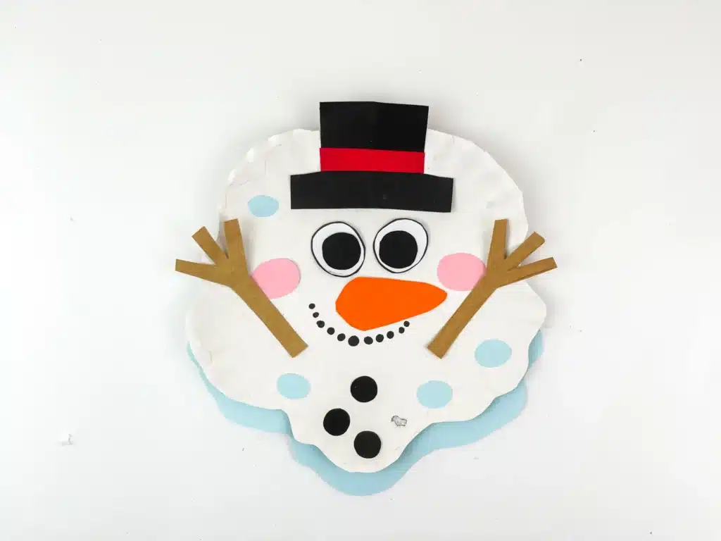 Melted Snowman Paper Plate Craft - Cultivating Brilliant Minds a paper plate craft decorated to look like a melted snowman