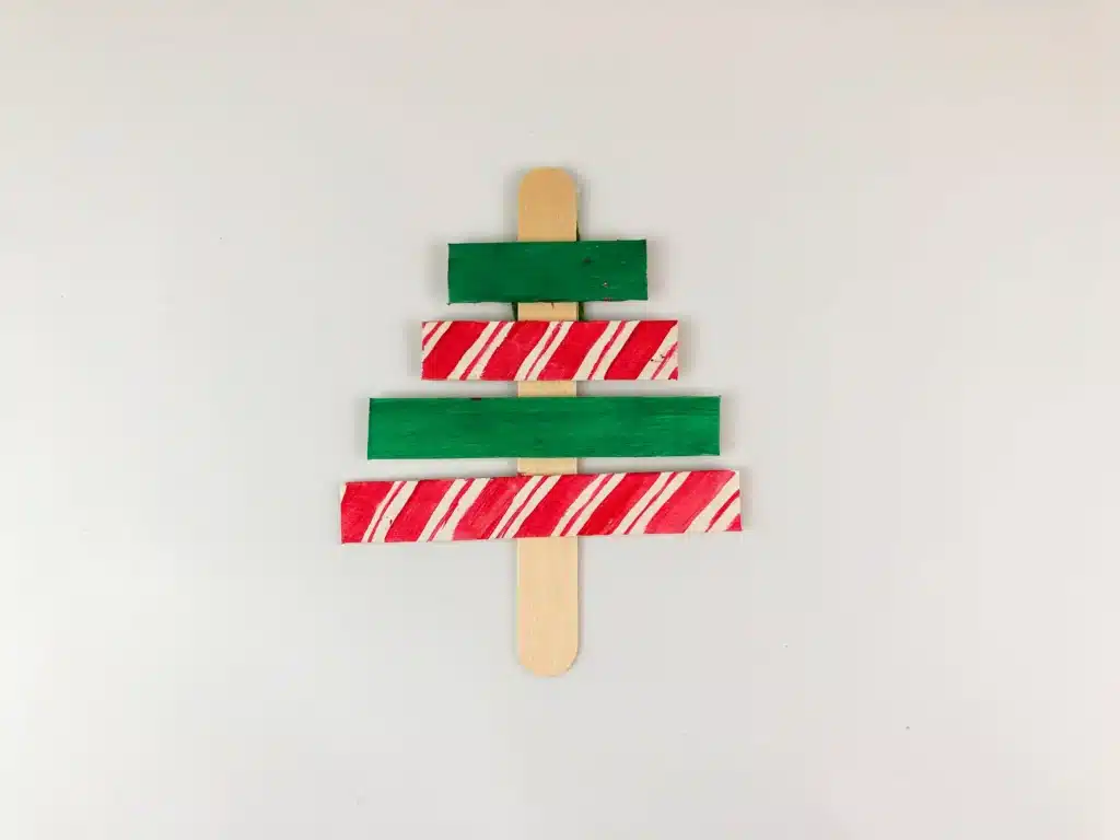 Christmas Tree Popsicle Stick Ornament - Cultivating Brilliant Minds popsicle sticks organized and decorated to look like a christmas tree