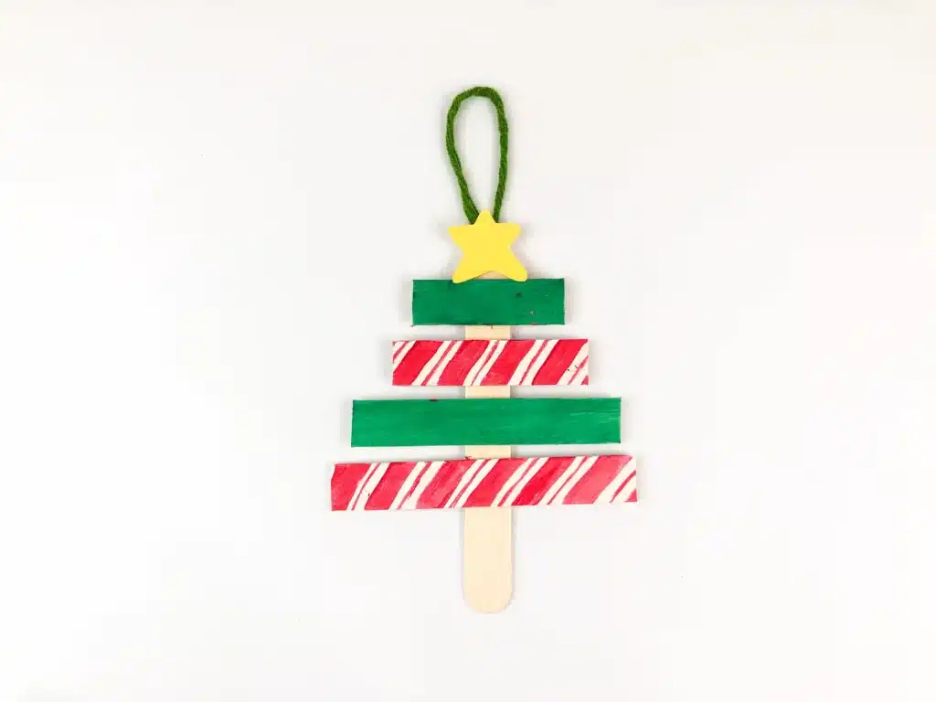 Christmas Tree Popsicle Stick Ornament - Cultivating Brilliant Minds popsicle sticks organized and decorated to look like a christmas tree
