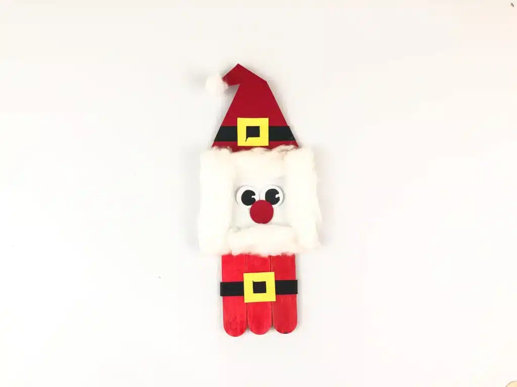 Santa Popsicle Stick Ornament Craft - Cultivating Brilliant Minds a santa ornament made with popsicle sticks and construction paper