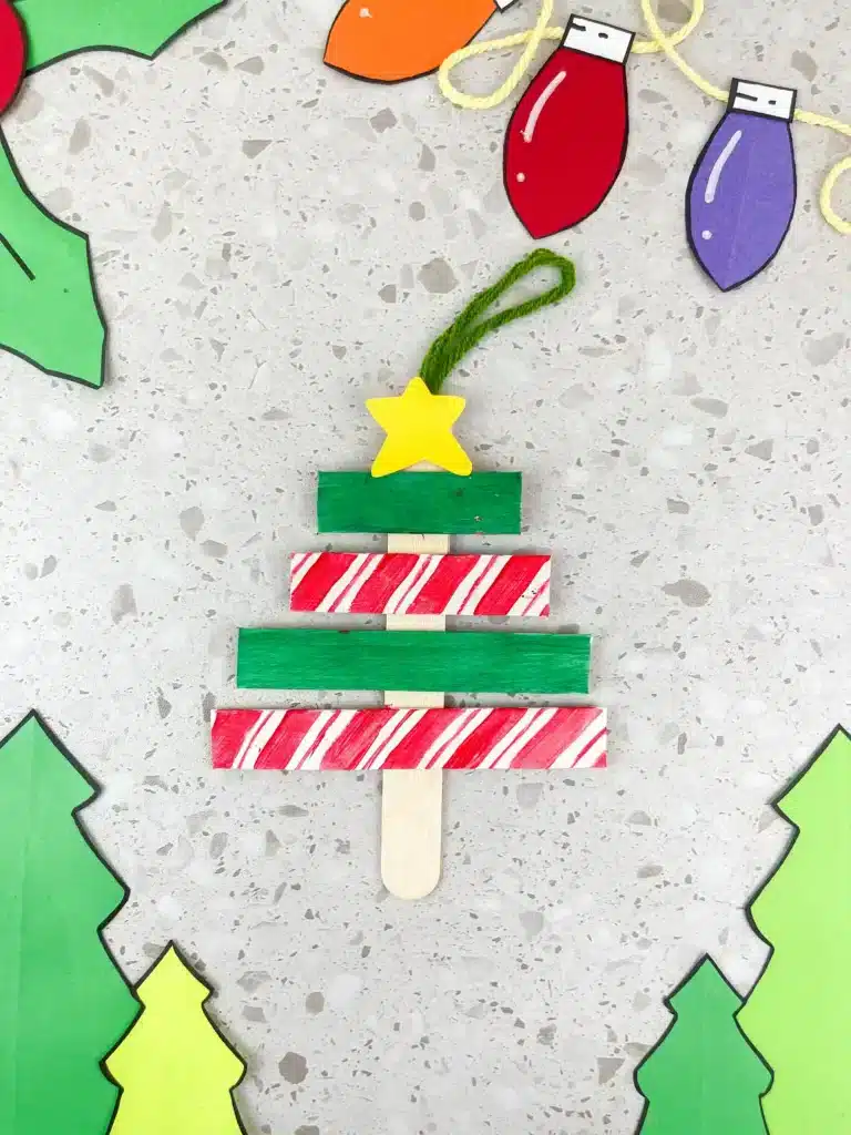 Christmas Tree Popsicle Stick Ornament - Cultivating Brilliant Minds popsicle sticks organized and decorated to look like a christmas tree