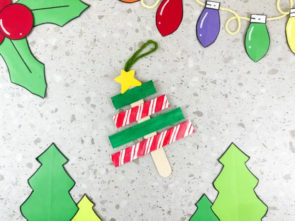 Christmas Tree Popsicle Stick Ornament - Cultivating Brilliant Minds popsicle sticks organized and decorated to look like a christmas tree