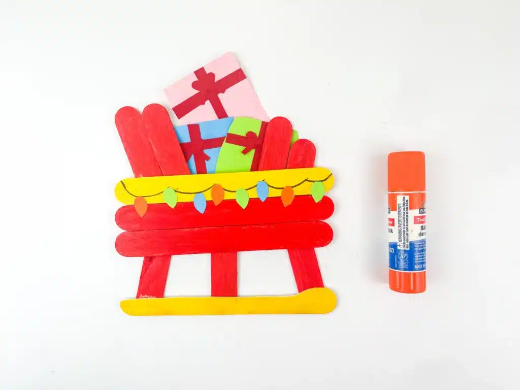 Santa Sleigh Craft - Cultivating Brilliant Minds a santa sleigh craft made out of popsicle sticks