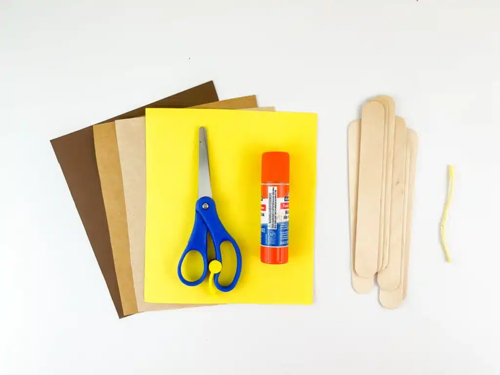 Manger Popsicle Stick Craft - Cultivating Brilliant Minds manger popsicle stick craft supplies: yellow, brown, and tan construction paper, scissors, glue, and popsicle sticks