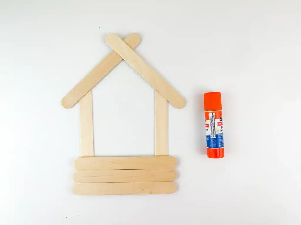 Manger Popsicle Stick Craft - Cultivating Brilliant Minds popsicle sticks glued together to look like a manger