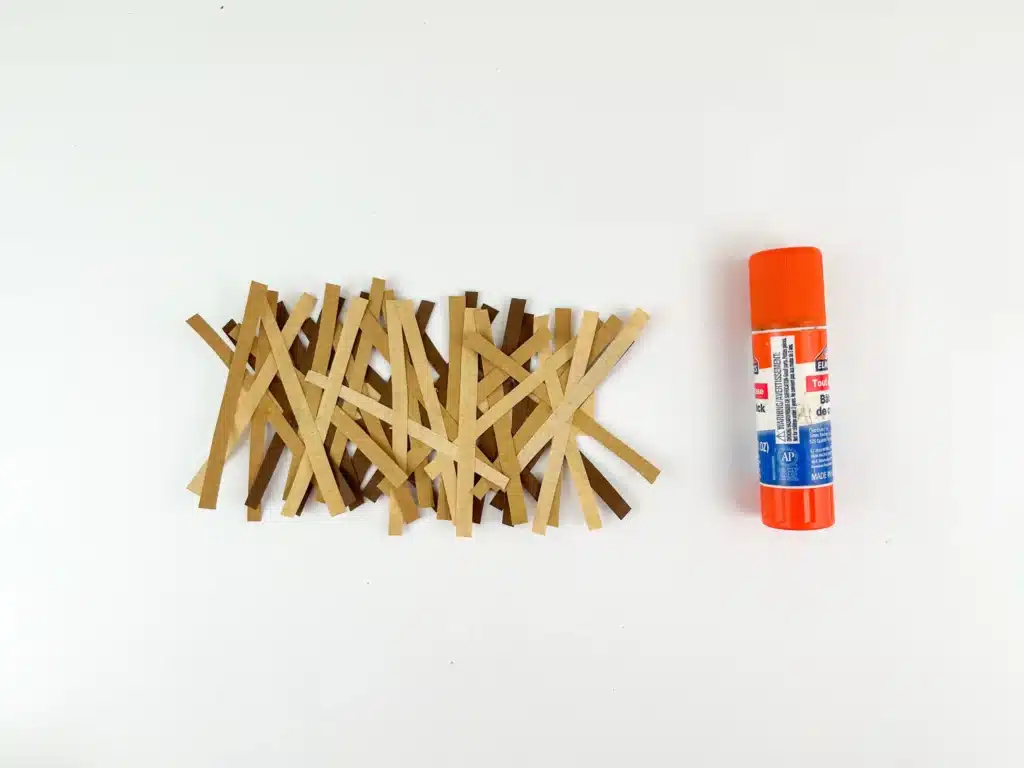 Manger Popsicle Stick Craft - Cultivating Brilliant Minds brown and tan construction paper cut into strips