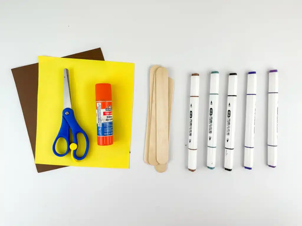 Nativity Popsicle Stick Craft - Cultivating Brilliant Minds yellow and brown construction paper, scissors, glue, popsicle sticks, and markers