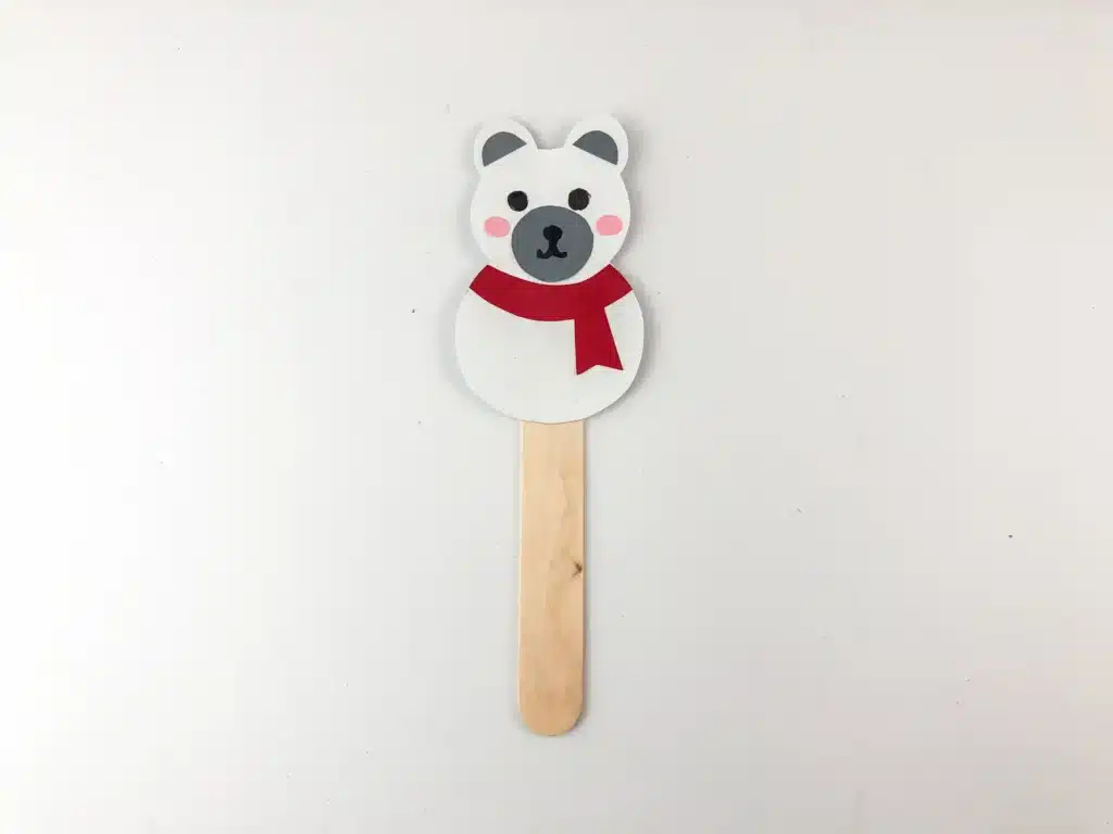 Moving Polar Bear Craft - Cultivating Brilliant Minds a polar bear made from construction paper attached to a popsicle stick