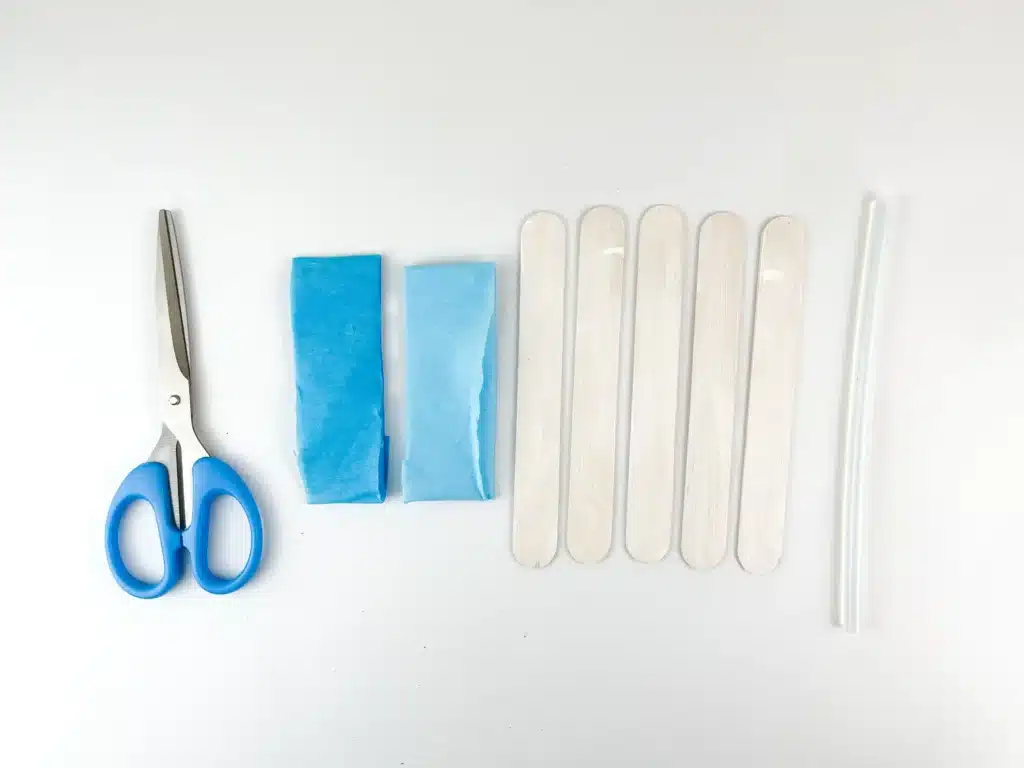 Dreidel Craft for Hanukkah - Cultivating Brilliant Minds scissors, blue japanese paper, and popsicle sticks