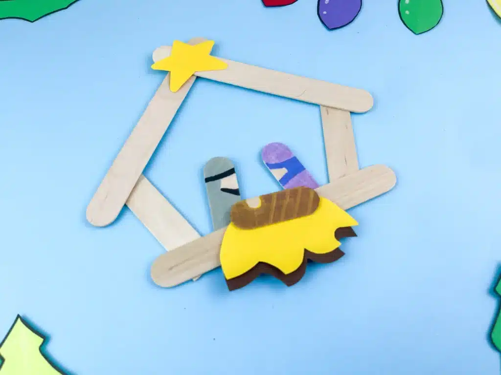 Nativity Popsicle Stick Craft - Cultivating Brilliant Minds a nativity scene made out of popsicle sticks and construction paper