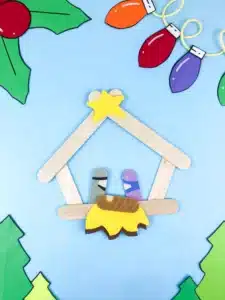 a nativity scene made out of popsicle sticks and construction paper
