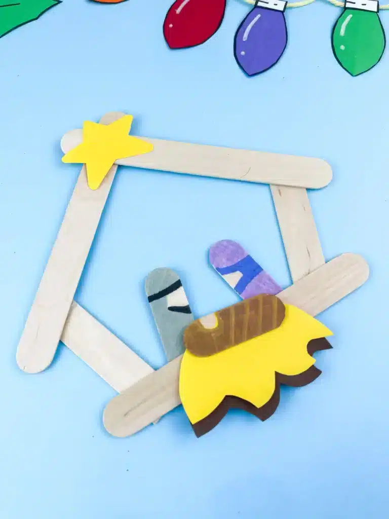 Nativity Popsicle Stick Craft - Cultivating Brilliant Minds a nativity scene made out of popsicle sticks and construction paper