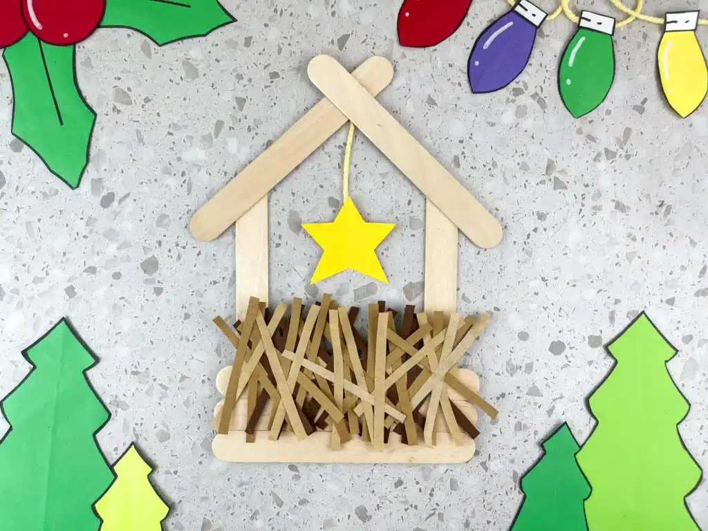 Manger Popsicle Stick Craft - Cultivating Brilliant Minds a manger made out of popsicle sticks and construction paper