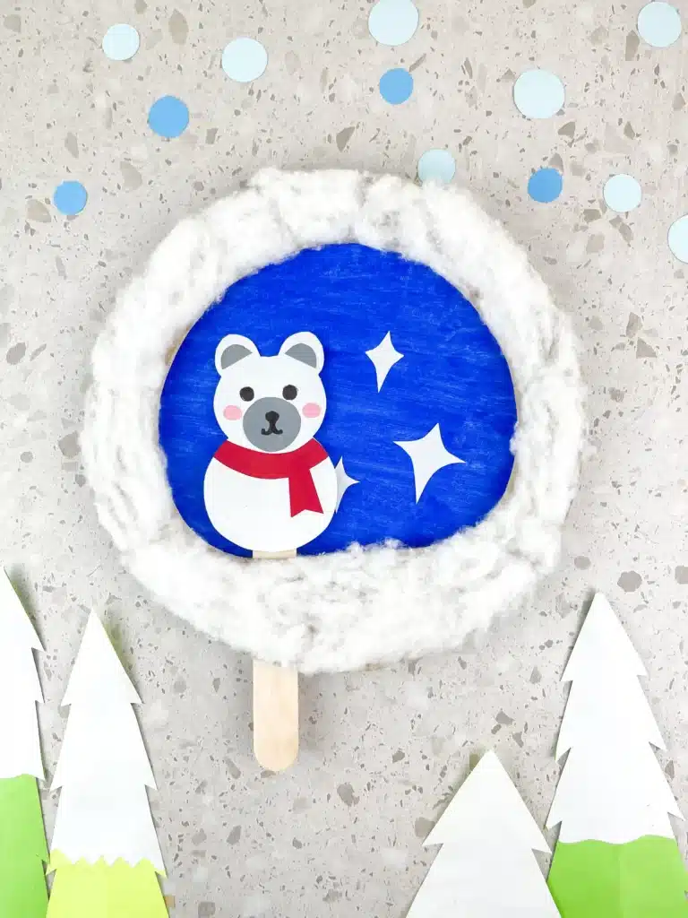 Moving Polar Bear Craft - Cultivating Brilliant Minds a paper plate craft with a polar bear attached to a popsicle stick so it can move back and forth