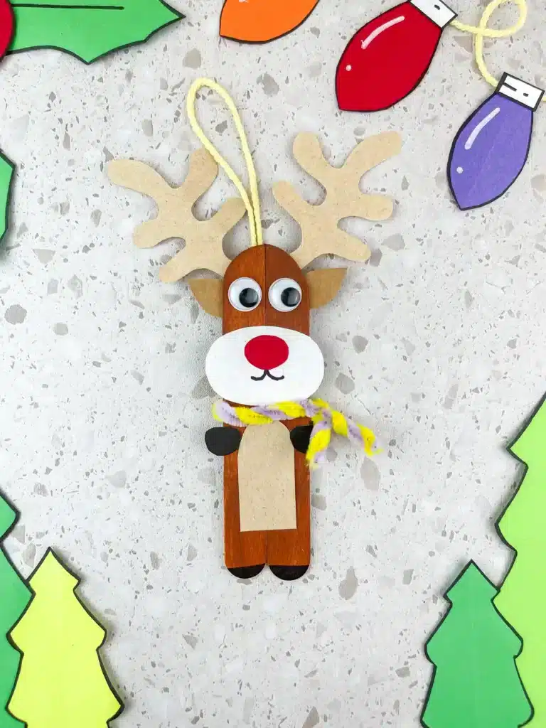 Reindeer Popsicle Stick Ornament Craft - Cultivating Brilliant Minds popsicle sticks glued together and decorated to look like a reindeer