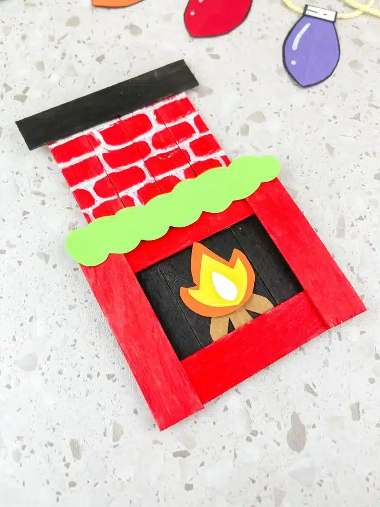 Fireplace Popsicle Stick Craft - Cultivating Brilliant Minds popsicle sticks and construction paper glued together to make a fireplace popsicle stick craft