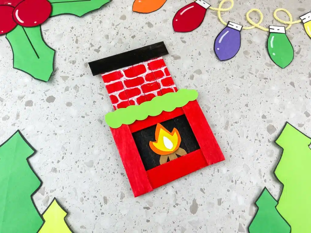 Fireplace Popsicle Stick Craft - Cultivating Brilliant Minds popsicle sticks and construction paper glued together to make a fireplace popsicle stick craft