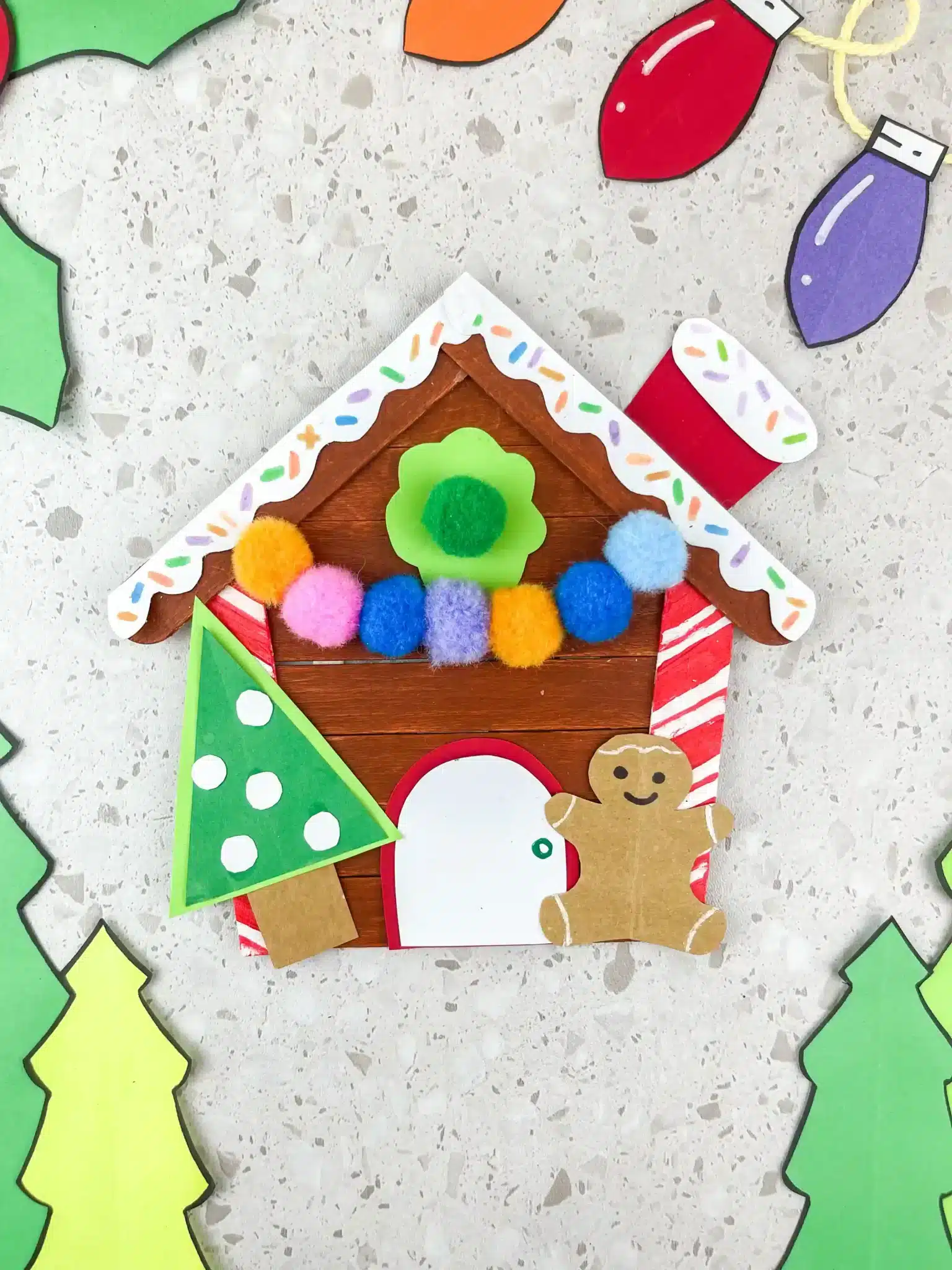 gingerbread house craft made out of popsicle sticks