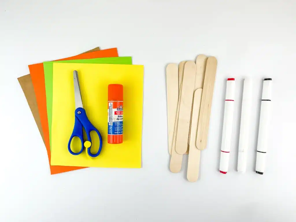 Fireplace Popsicle Stick Craft - Cultivating Brilliant Minds colored construction paper, scissors, glue, popsicle sticks, and markers