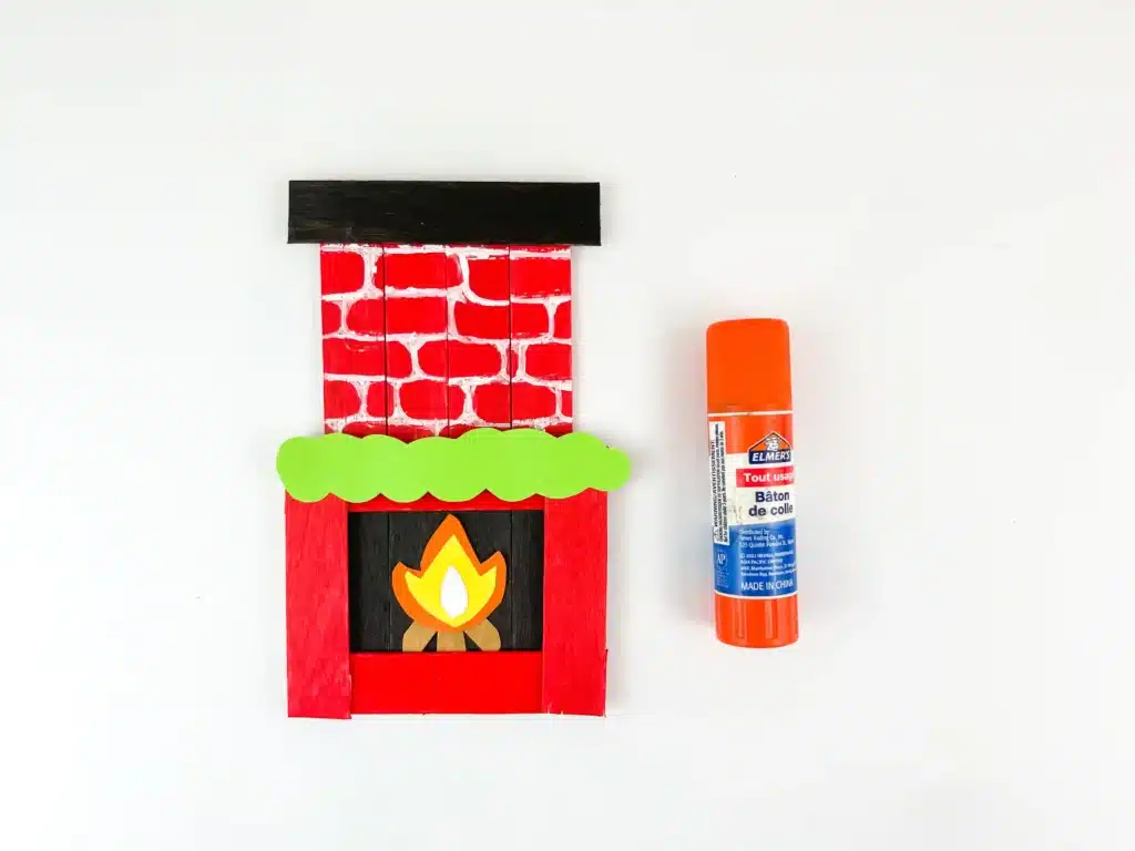 Fireplace Popsicle Stick Craft - Cultivating Brilliant Minds popsicle sticks and construction paper glued together to make a fireplace popsicle stick craft