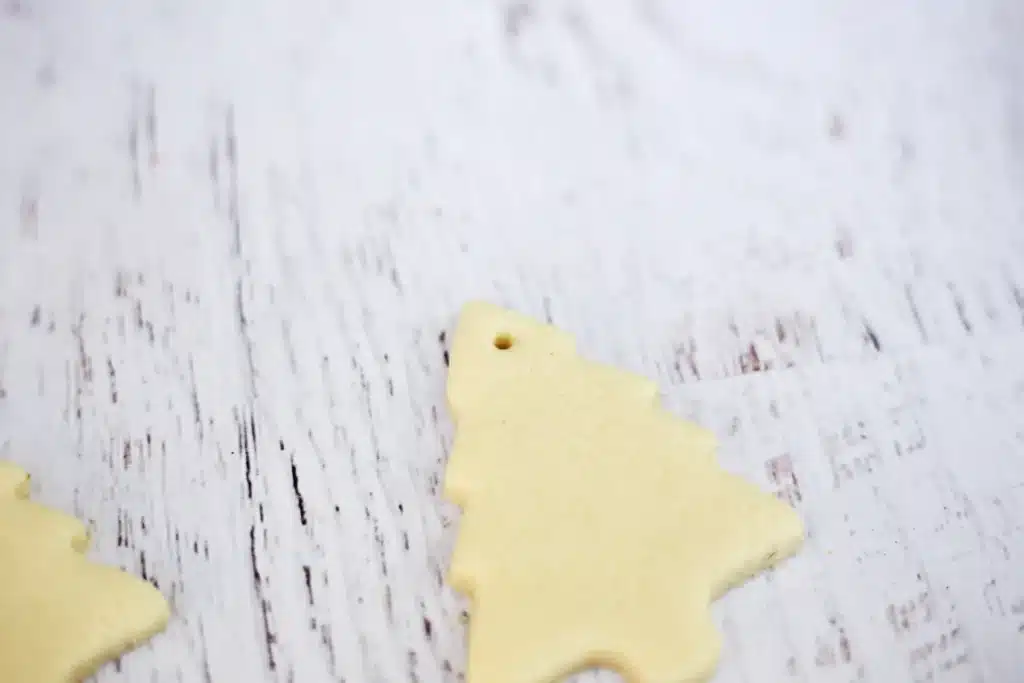 Fingerprint Salt Dough Christmas Tree Ornament - Cultivating Brilliant Minds a salt dough christmas tree with a hole poked at the top