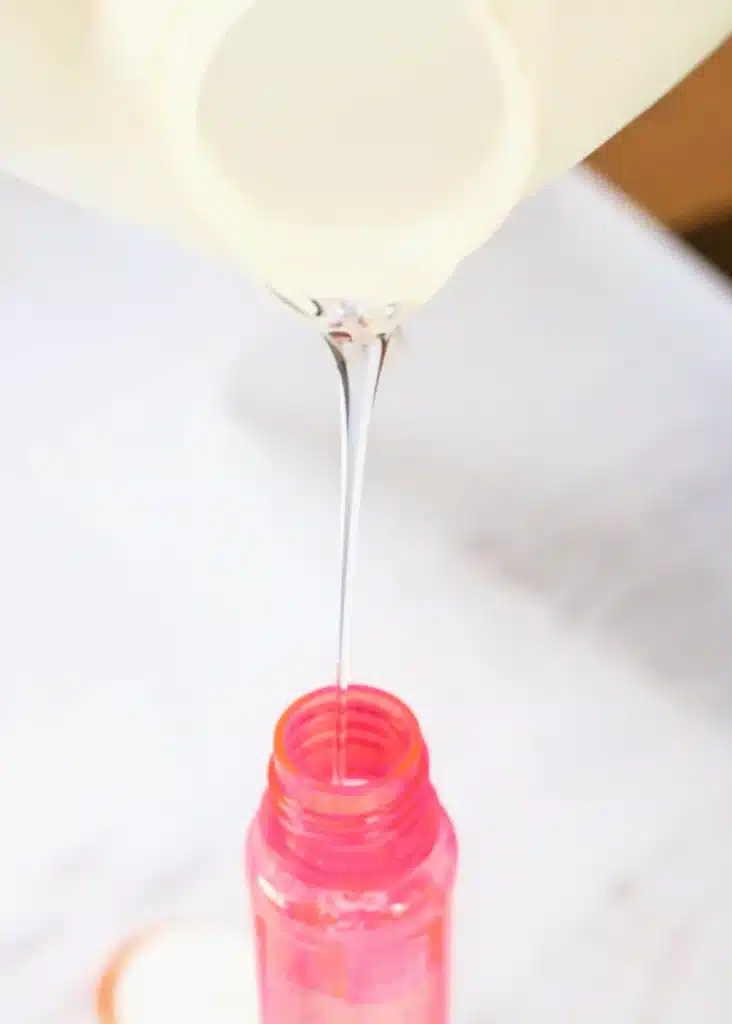 Candy Cane Sensory Wand - Cultivating Brilliant Minds pouring glue into the bubble wand