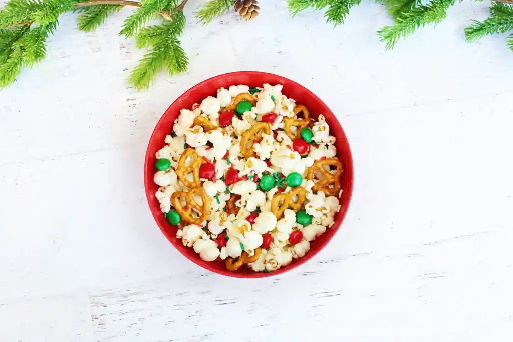 Rudolph Popcorn Snack Mix - Cultivating Brilliant Minds rudolph popcorn snack mix with pretzels and m&ms in a bowl