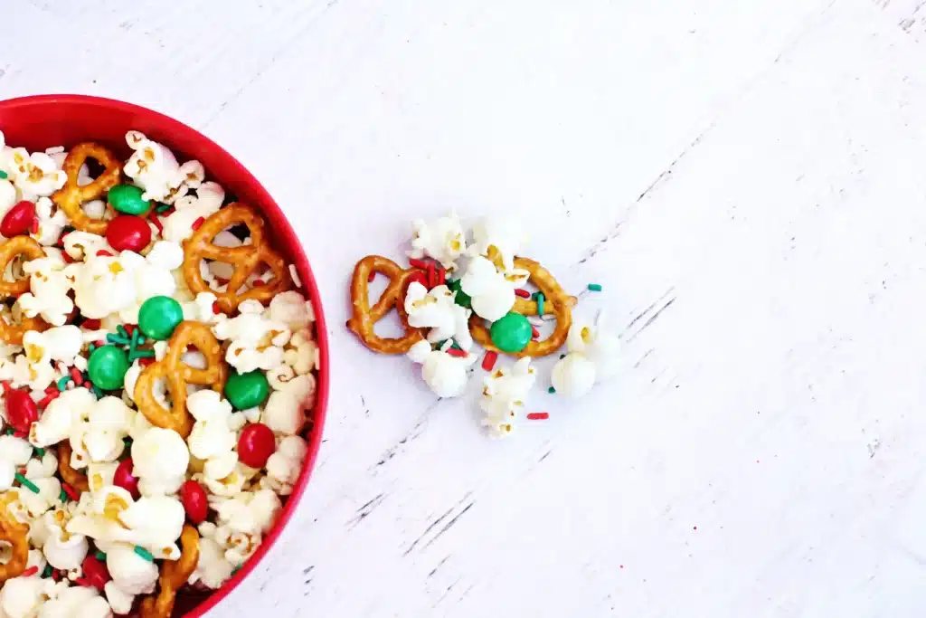 Rudolph Popcorn Snack Mix - Cultivating Brilliant Minds rudolph popcorn snack mix with pretzels and m&ms in a bowl