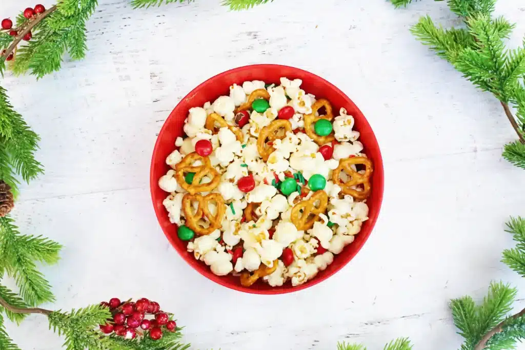 Rudolph Popcorn Snack Mix - Cultivating Brilliant Minds rudolph popcorn snack mix with pretzels and m&ms in a bowl