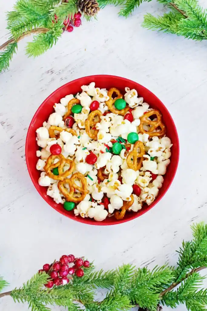 Rudolph Popcorn Snack Mix - Cultivating Brilliant Minds rudolph popcorn snack mix with pretzels and m&ms in a bowl