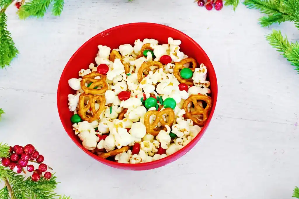 Rudolph Popcorn Snack Mix - Cultivating Brilliant Minds rudolph popcorn snack mix with pretzels and m&ms in a bowl
