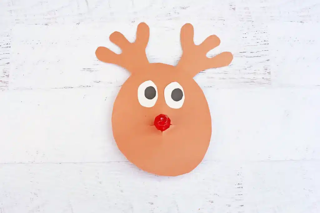 Rudolph Ring Pop Craft - Cultivating Brilliant Minds a reindeer craft made of construction paper using a ring pop as the nose