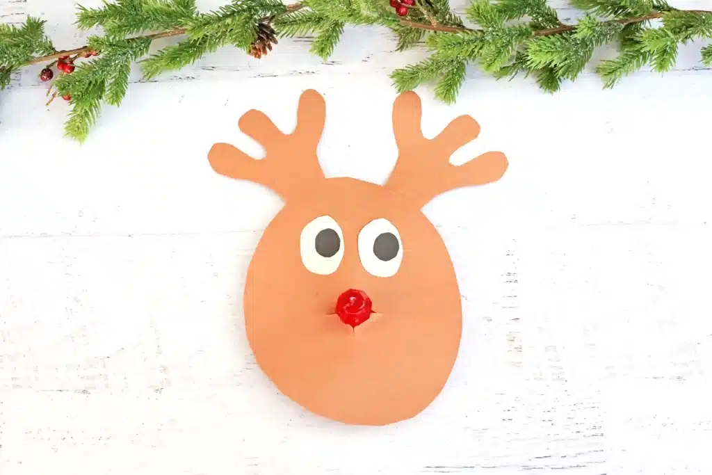 Rudolph Ring Pop Craft - Cultivating Brilliant Minds a reindeer craft made of construction paper using a ring pop as the nose