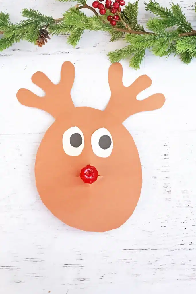 Rudolph Ring Pop Craft - Cultivating Brilliant Minds a reindeer craft made of construction paper using a ring pop as the nose