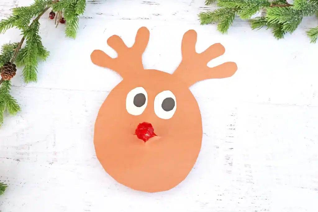 Rudolph Ring Pop Craft - Cultivating Brilliant Minds a reindeer craft made of construction paper using a ring pop as the nose