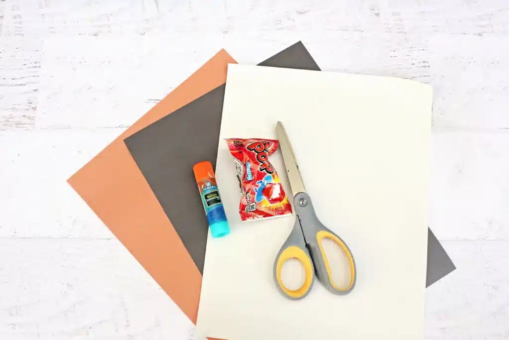 Rudolph Ring Pop Craft - Cultivating Brilliant Minds black, brown, and white construction paper, scissors, glue, and a ring pop