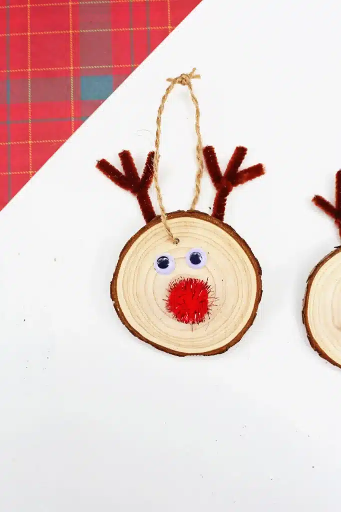 Rudolph Wood Slice Ornament - Cultivating Brilliant Minds a wood slice decorated to look like rudolph and made into an ornament for the tree