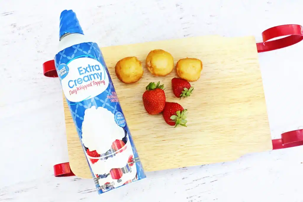 Santa Hat Muffins - Cultivating Brilliant Minds whipped cream, mini muffins, and strawberries