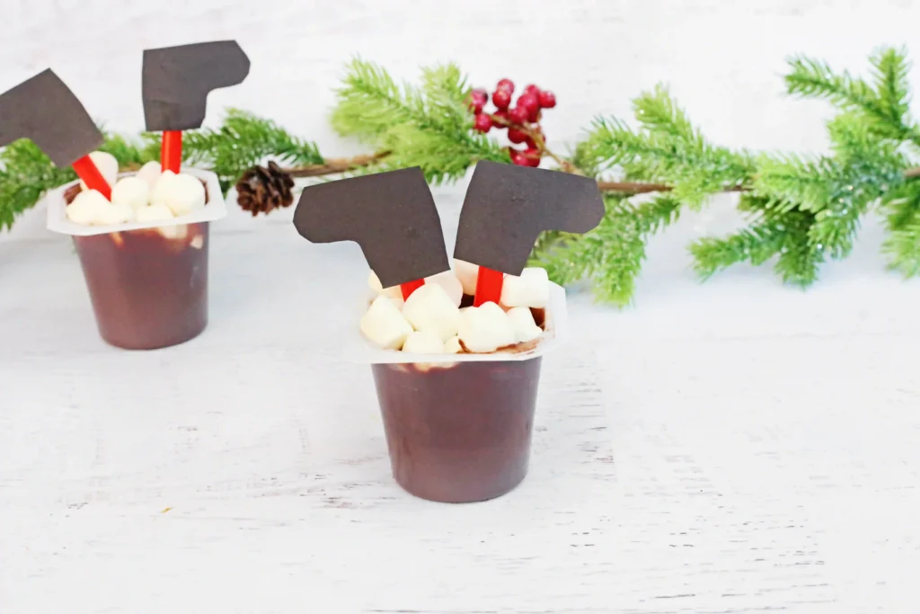Santa in the Chimney Pudding Snack - Cultivating Brilliant Minds a christmas treat for kids using a pudding cup and decorating it to look like santa is sticking out of the chimney