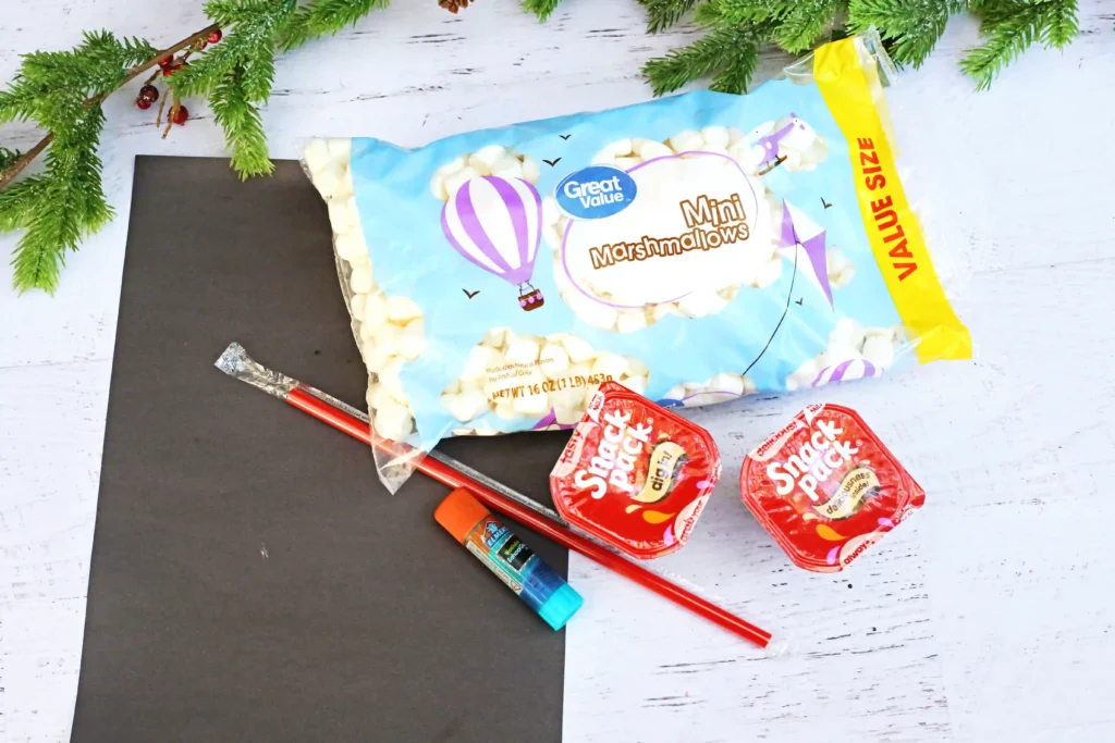 Santa in the Chimney Pudding Snack - Cultivating Brilliant Minds marshmallows, pudding cups, black construction paper, straws, and a glue stick